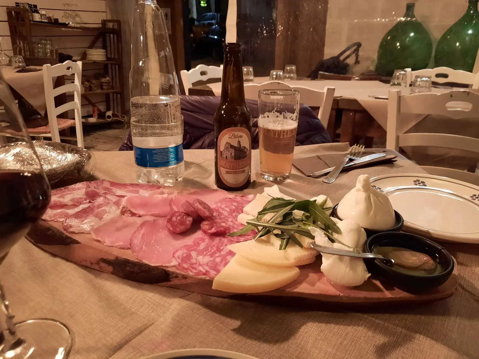 Traditional cured meats and cheese platter in Matera