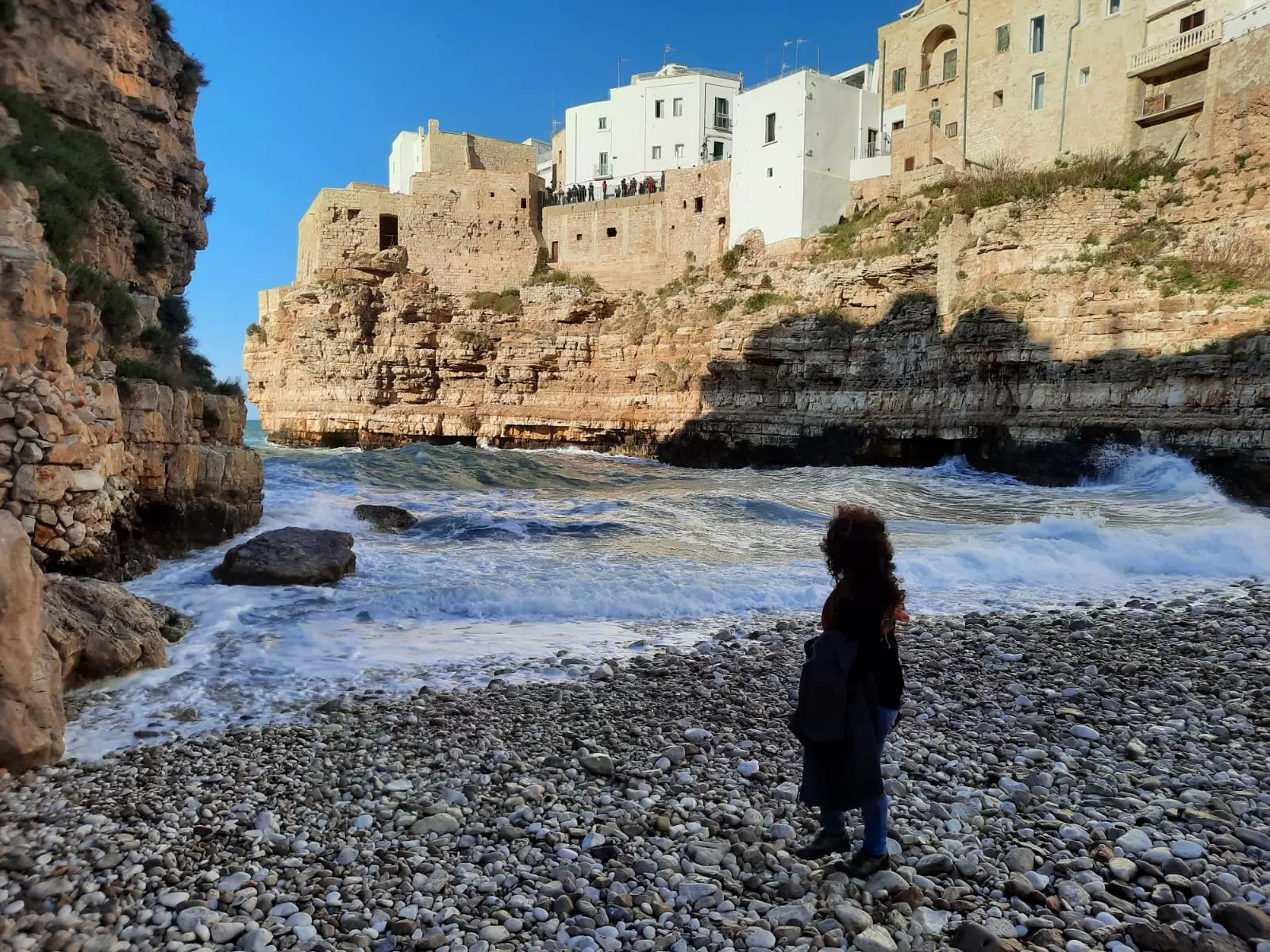 Anna looking at the sea from Lama Monachile beach