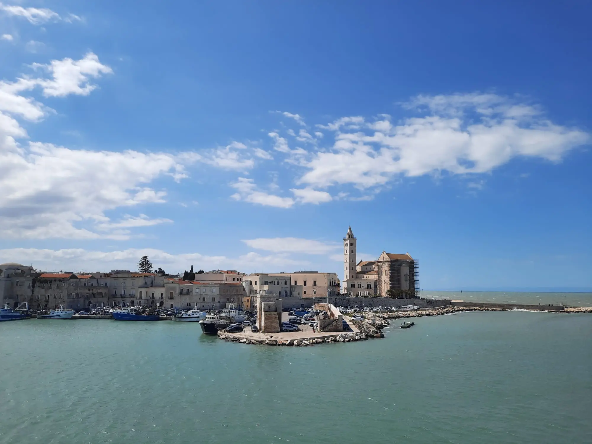 Panoramic view of old town Trani with cathedral bell tower and sea